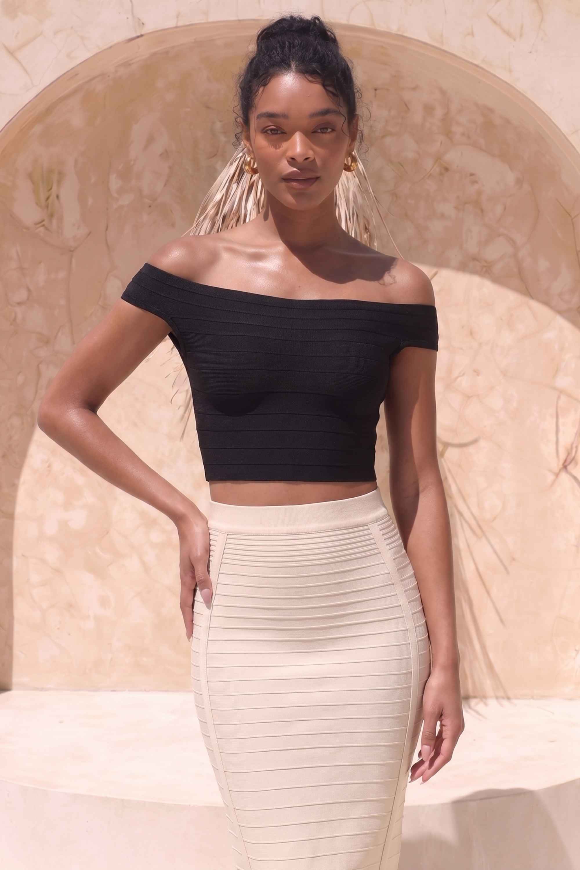 Woman wearing a figure flattering  Pencil High Waist Bandage Knee Length Knitted Skirt - Cream BODYCON COLLECTION
