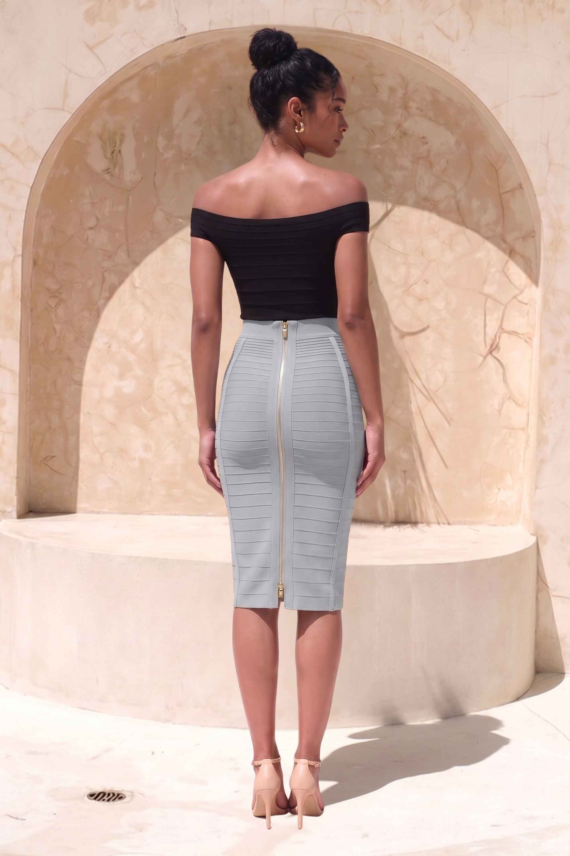 Woman wearing a figure flattering  Pencil High Waist Bandage Knee Length Knitted Skirt - Steel Grey BODYCON COLLECTION