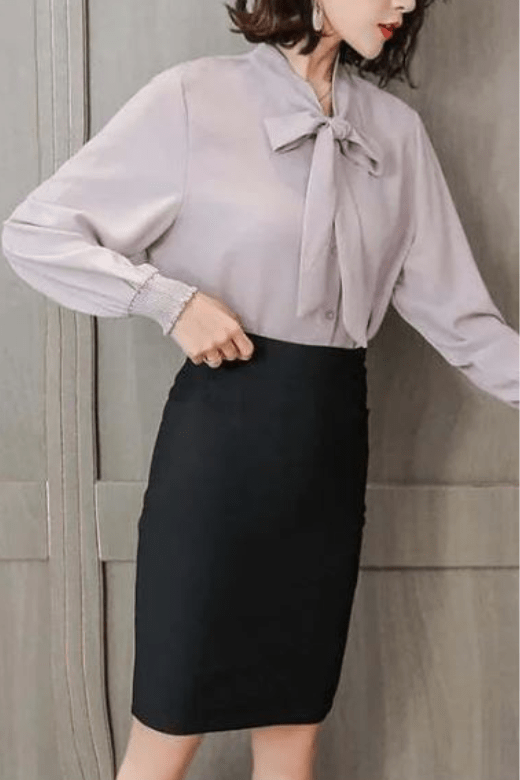 Woman wearing a figure flattering  Pencil High Waist Bandage Knee Length Skirt - Classic Black BODYCON COLLECTION