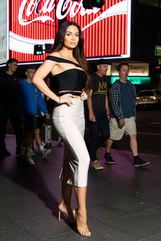 Woman wearing a figure flattering  Pencil High Waist Bandage Midi Skirt - Classic Black BODYCON COLLECTION