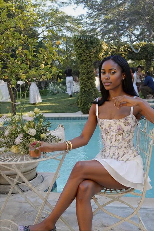 Woman wearing a figure flattering  Penny Corset Top - White Floral BODYCON COLLECTION Pty Ltd