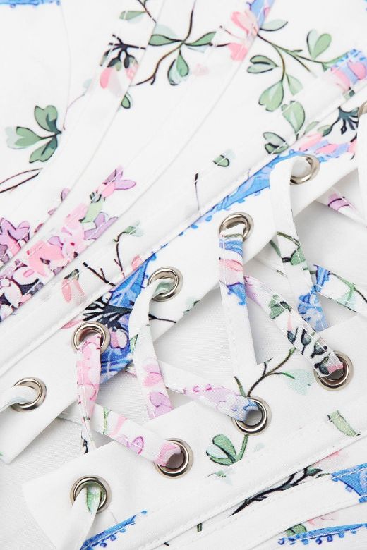 Woman wearing a figure flattering  Penny Corset Top - White Floral BODYCON COLLECTION Pty Ltd