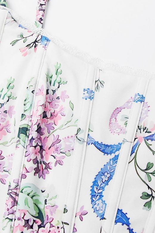 Woman wearing a figure flattering  Penny Corset Top - White Floral BODYCON COLLECTION Pty Ltd