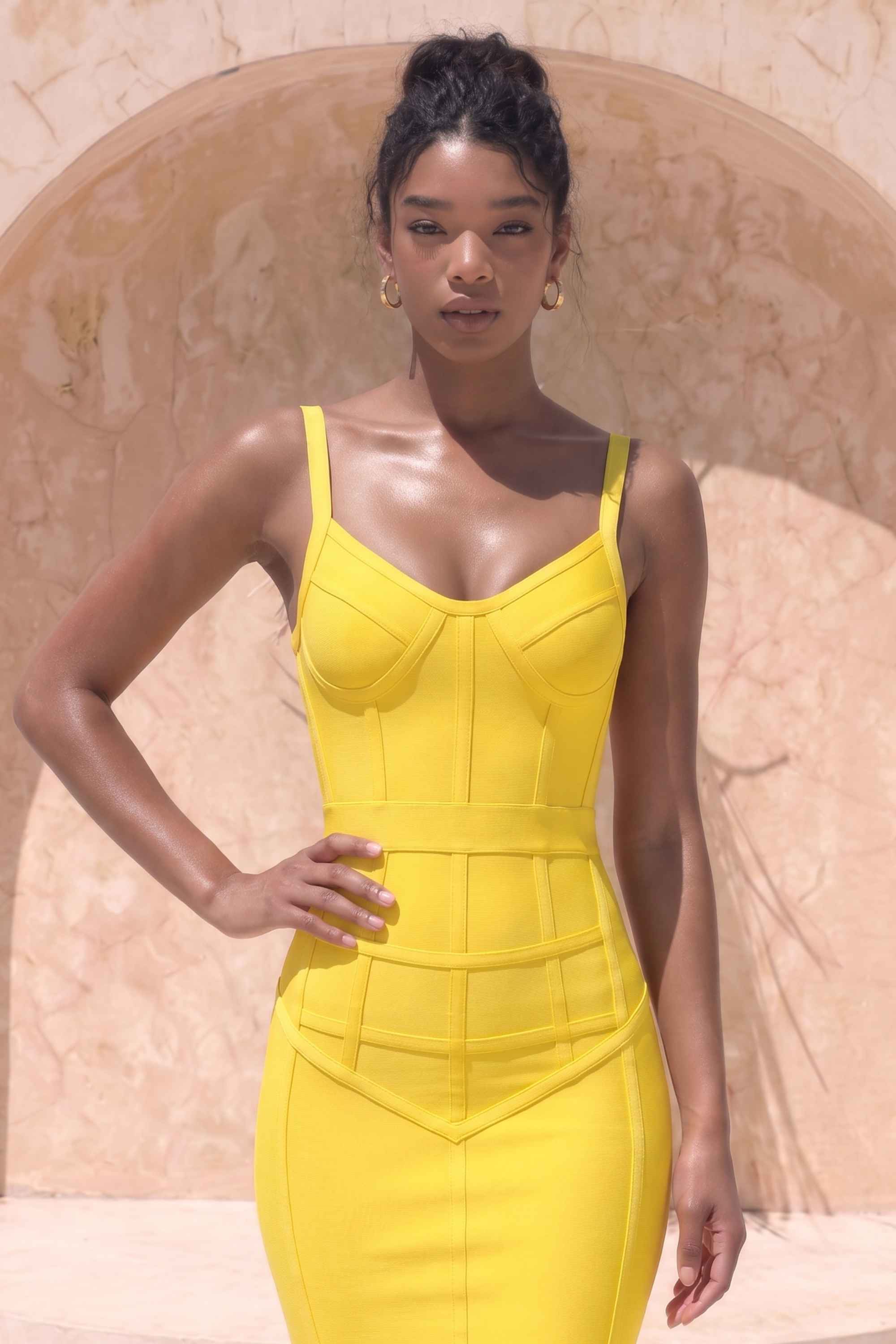 Woman wearing a figure flattering  Pip Bandage Corset Dress - Sun Yellow Bodycon Collection