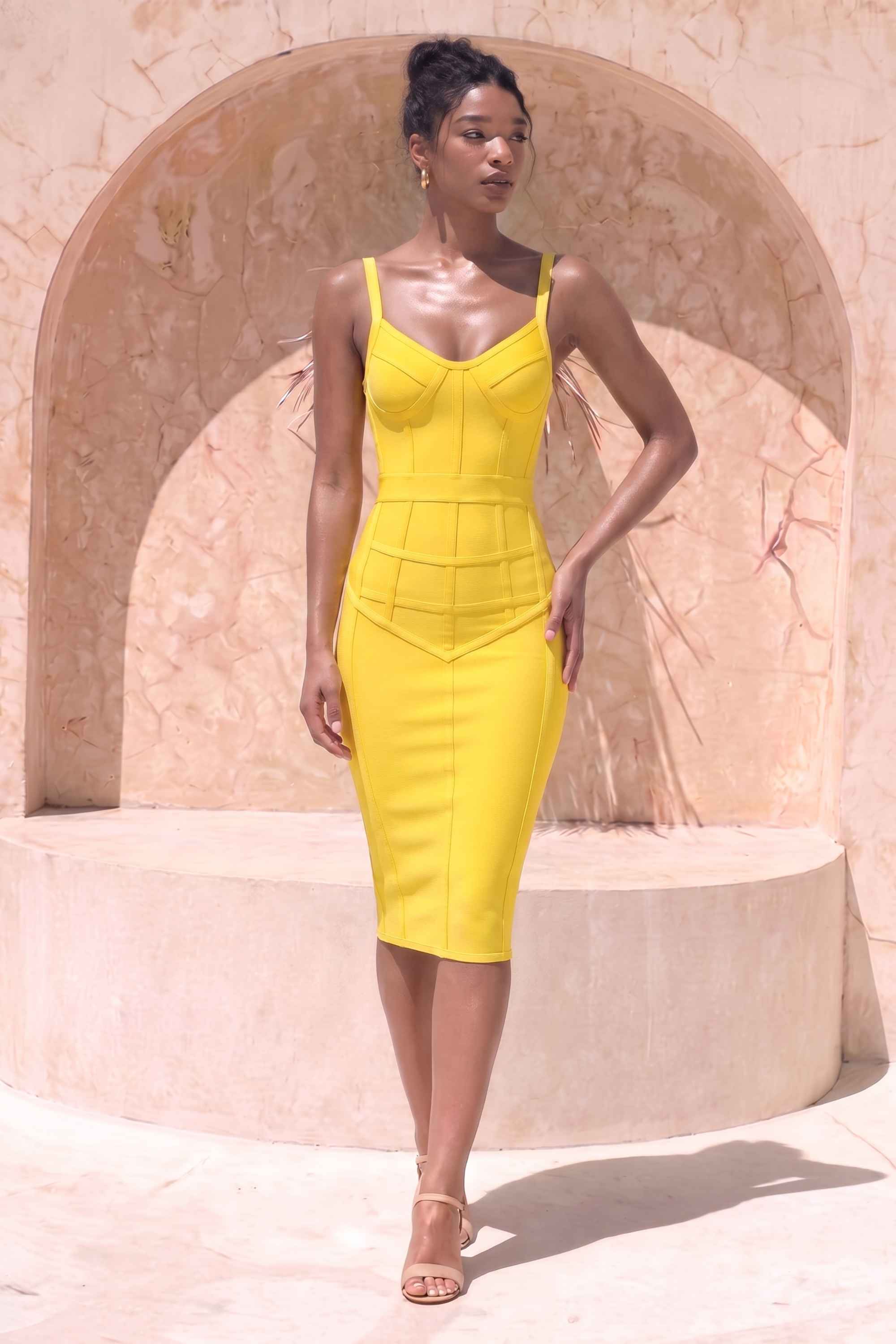 Woman wearing a figure flattering  Pip Bandage Corset Dress - Sun Yellow Bodycon Collection