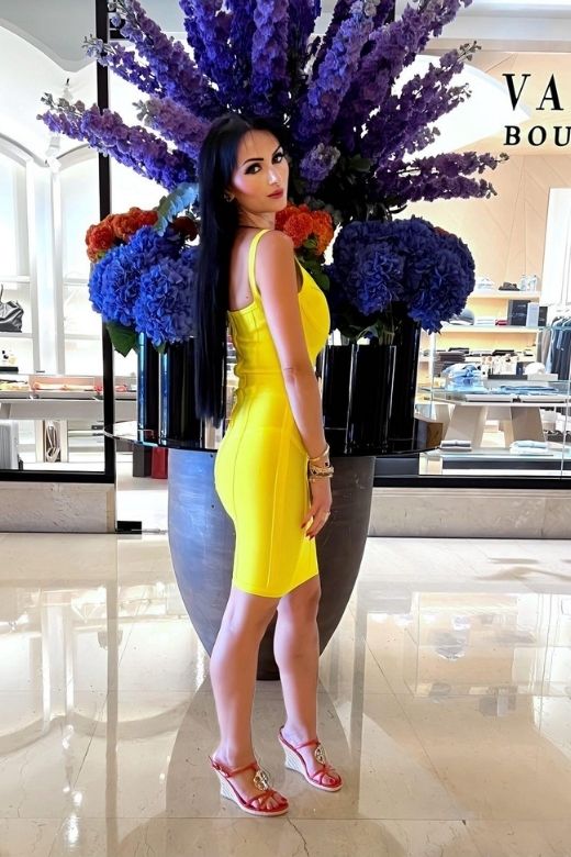 Woman wearing a figure flattering  Pip Bandage Mini Dress - Sun Yellow BODYCON COLLECTION