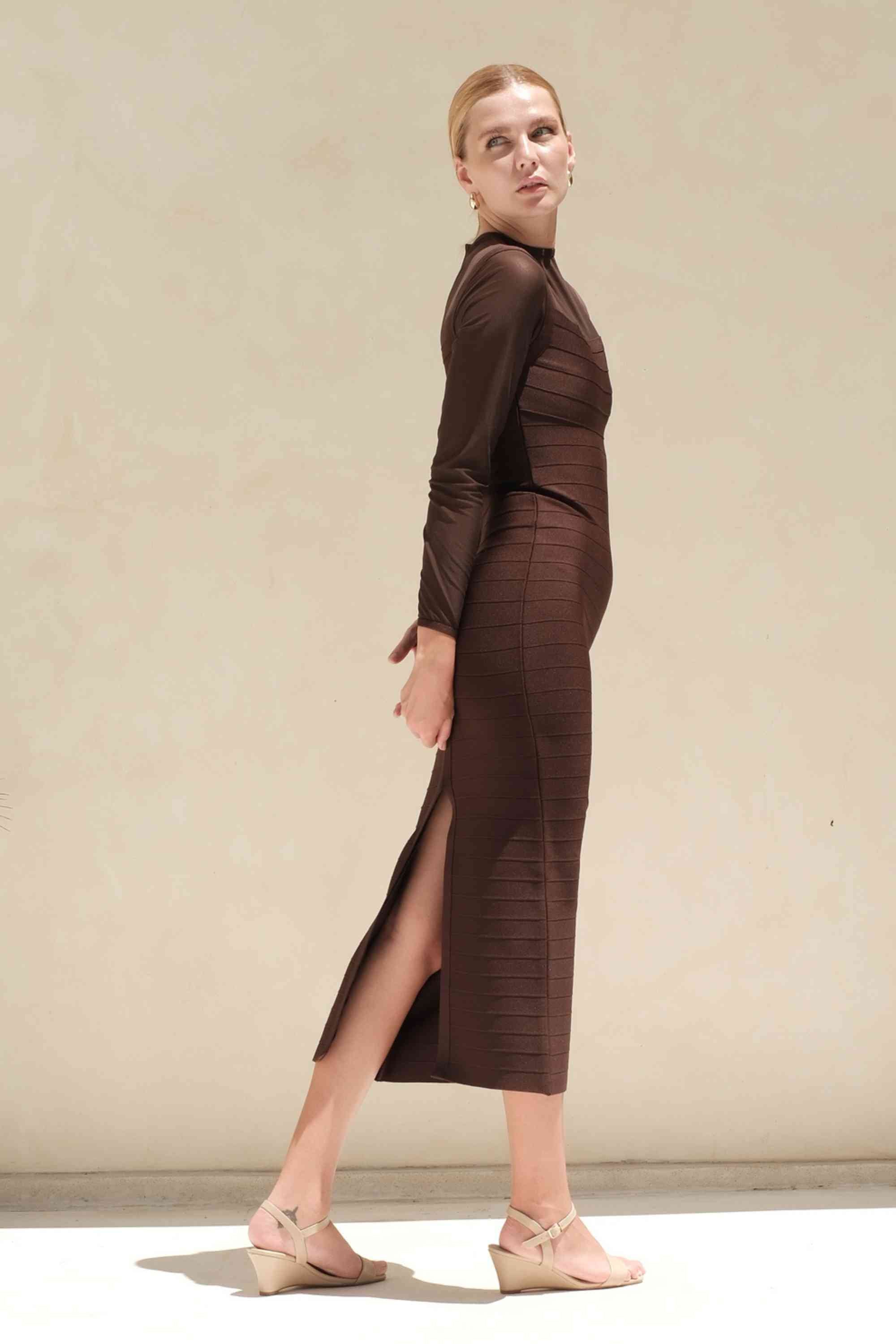 Woman wearing a figure flattering  Robin Long Sleeve Bandage Maxi Dress - Tan Brown BODYCON COLLECTION Pty Ltd