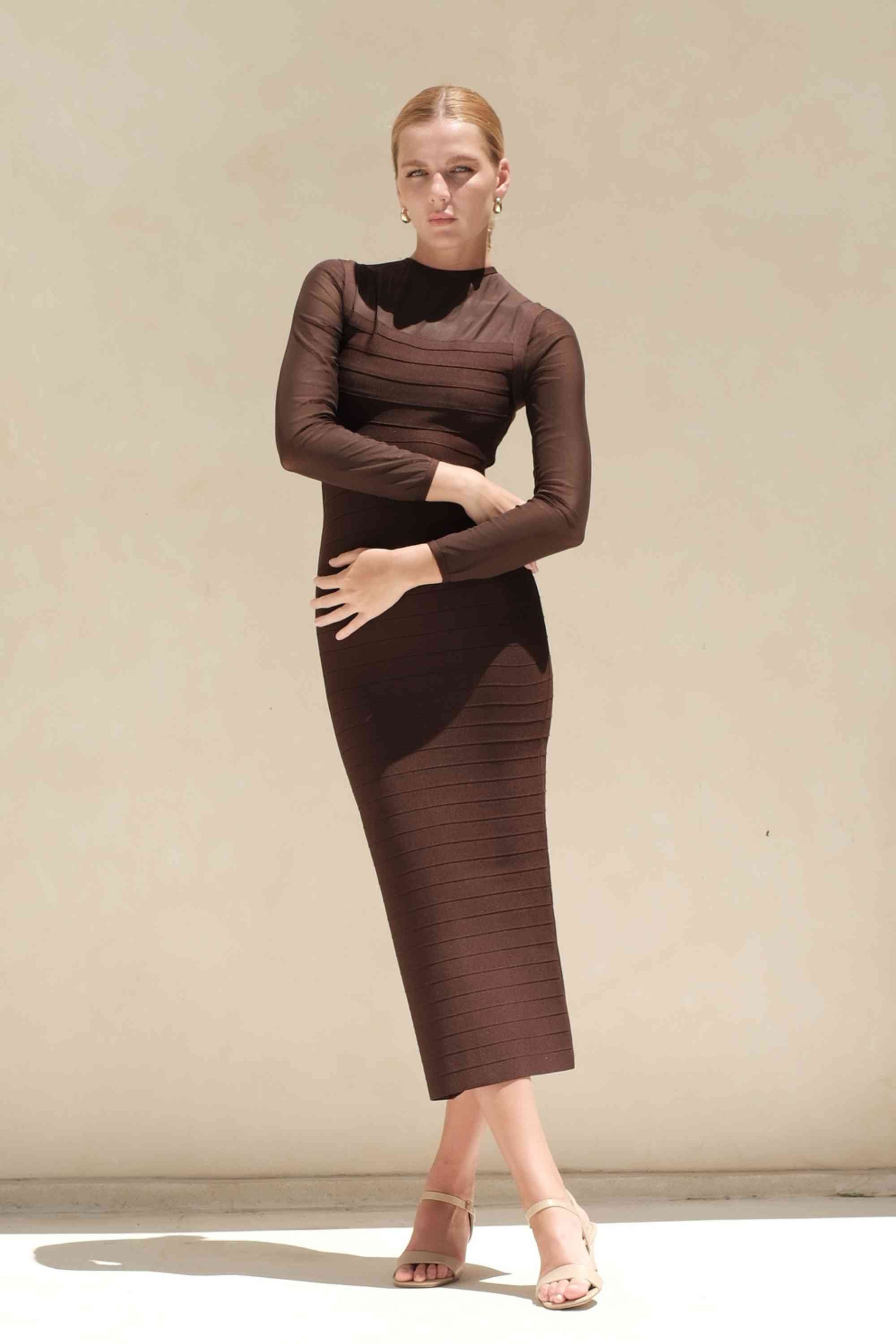 Woman wearing a figure flattering  Robin Long Sleeve Bandage Maxi Dress - Tan Brown BODYCON COLLECTION Pty Ltd
