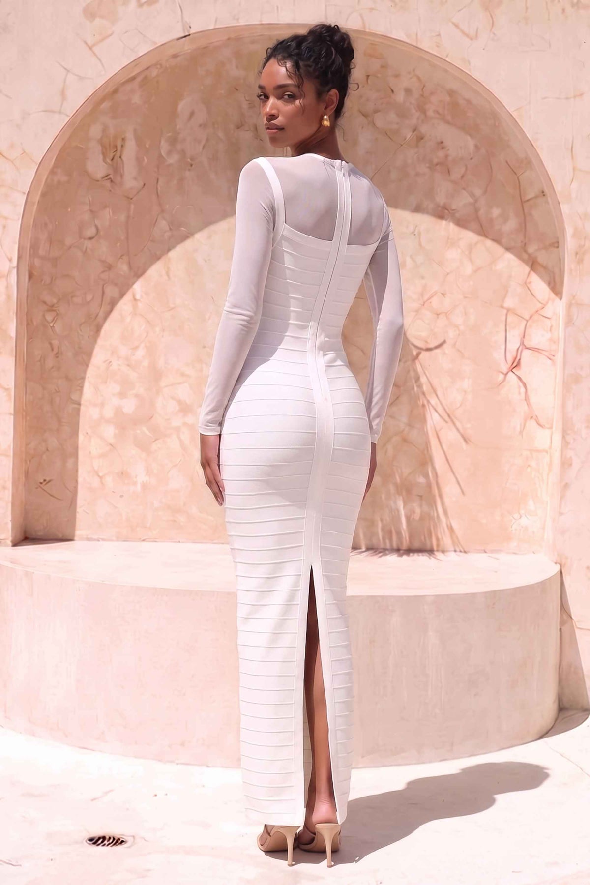 Woman wearing a figure flattering  Robin Long Sleeve Bandage Maxi Dress - White Pearl BODYCON COLLECTION Pty Ltd
