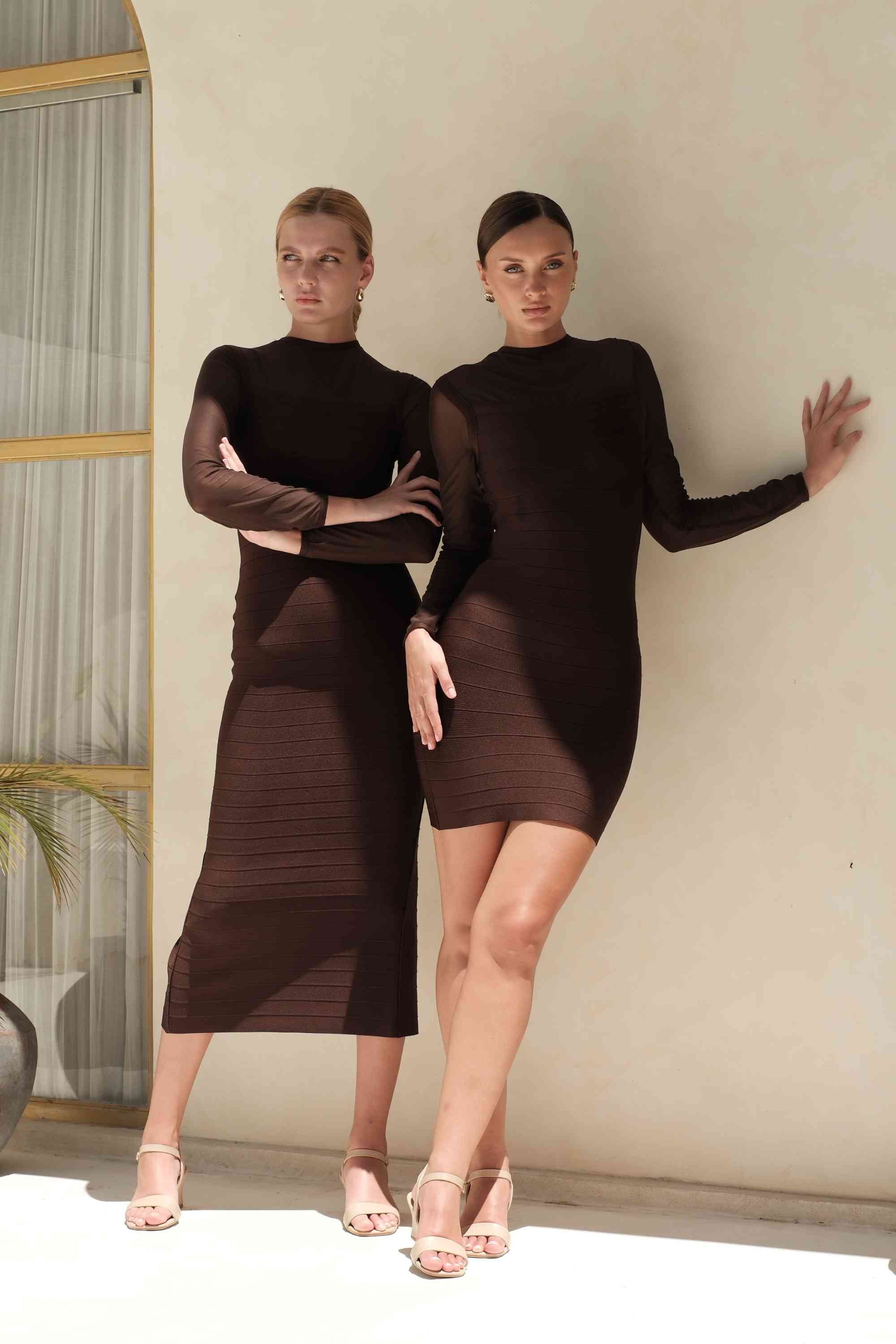 Woman wearing a figure flattering  Robin Long Sleeve Bandage Maxi Dress - White Pearl BODYCON COLLECTION Pty Ltd