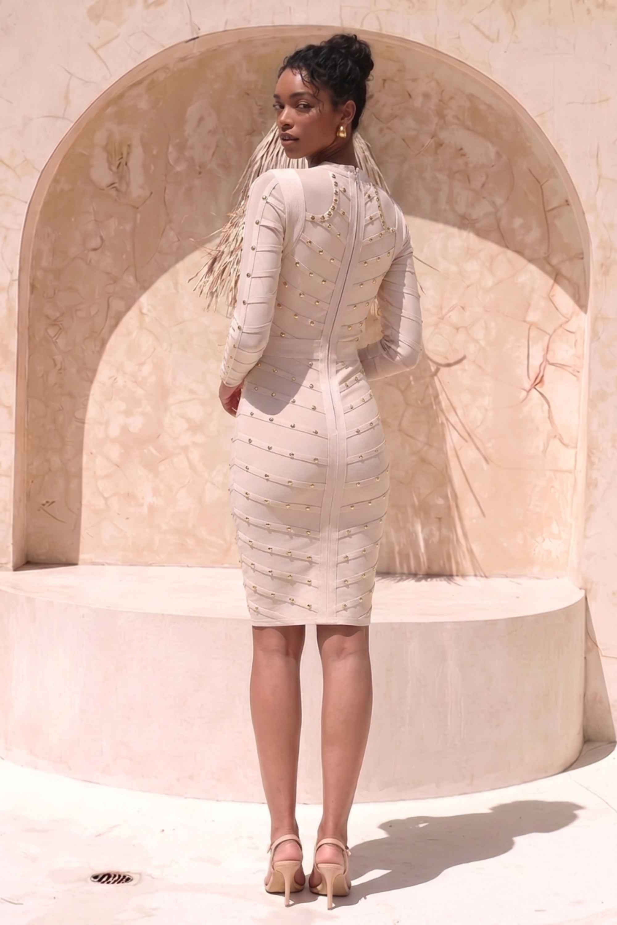 Woman wearing a figure flattering  Rosa Long Sleeve Bodycon Dress - Cream BODYCON COLLECTION