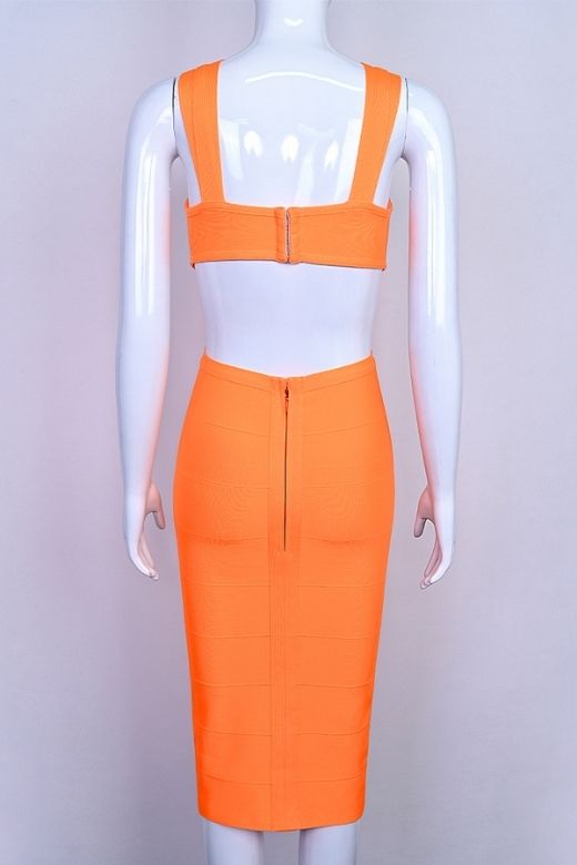 Woman wearing a figure flattering  Sasha Bandage Midi Dress - Apricot Orange BODYCON COLLECTION