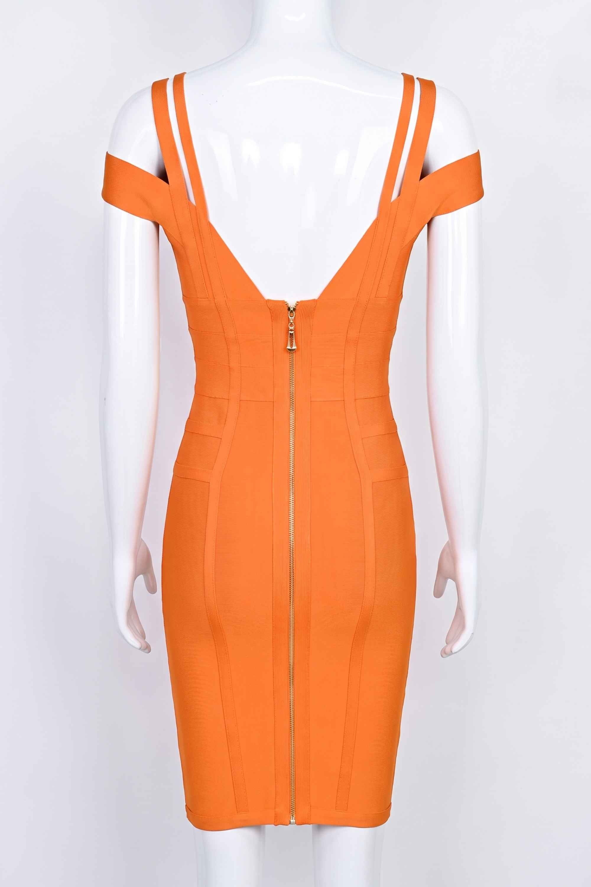 Woman wearing a figure flattering  Sia Bandage Dress - Apricot Orange Bodycon Collection