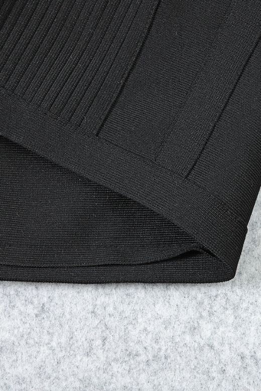 Woman wearing a figure flattering  Sophia Bandage Mini Dress - Classic Black Bodycon Collection