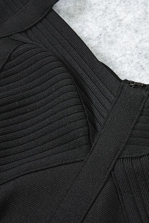 Woman wearing a figure flattering  Sophia Bandage Mini Dress - Classic Black Bodycon Collection