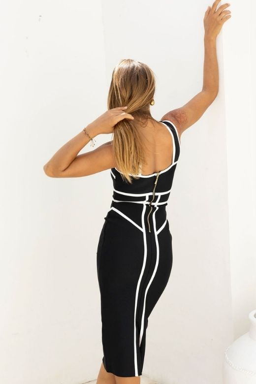 Woman wearing a figure flattering  Suki Bandage Midi Dress - Classic Black BODYCON COLLECTION