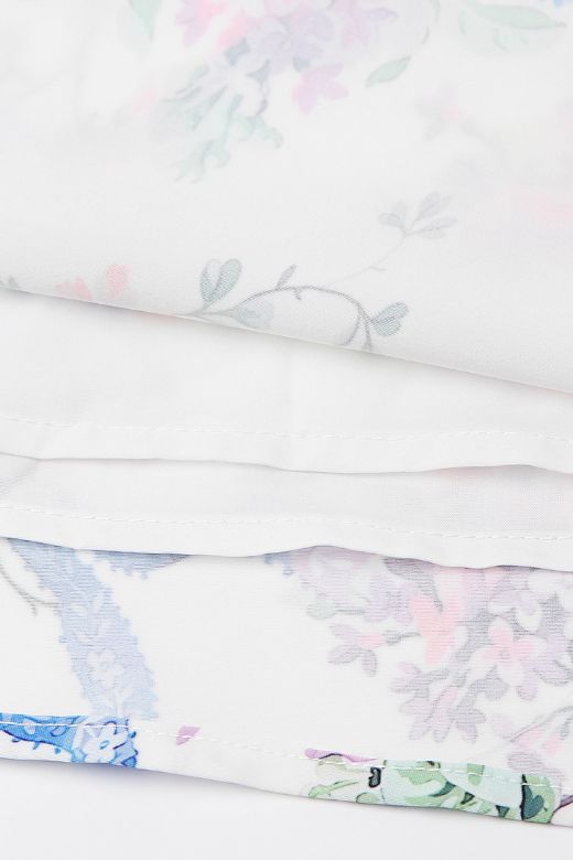 Woman wearing a figure flattering  Tasmin Bodycon Midi Dress - White Floral BODYCON COLLECTION