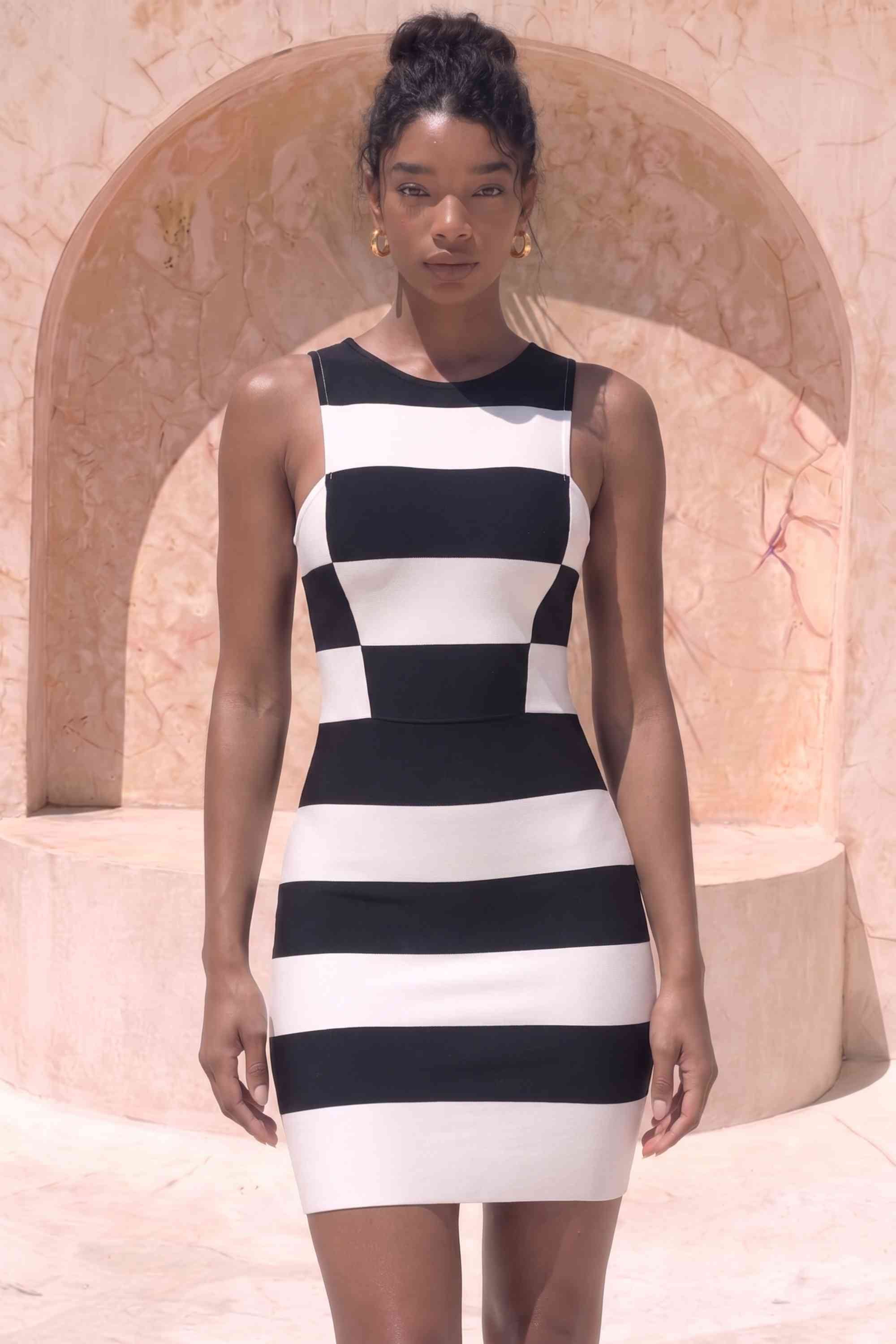 Woman wearing a figure flattering  Veronica Bodycon Mini Dress - Classic Black BODYCON COLLECTION Pty Ltd