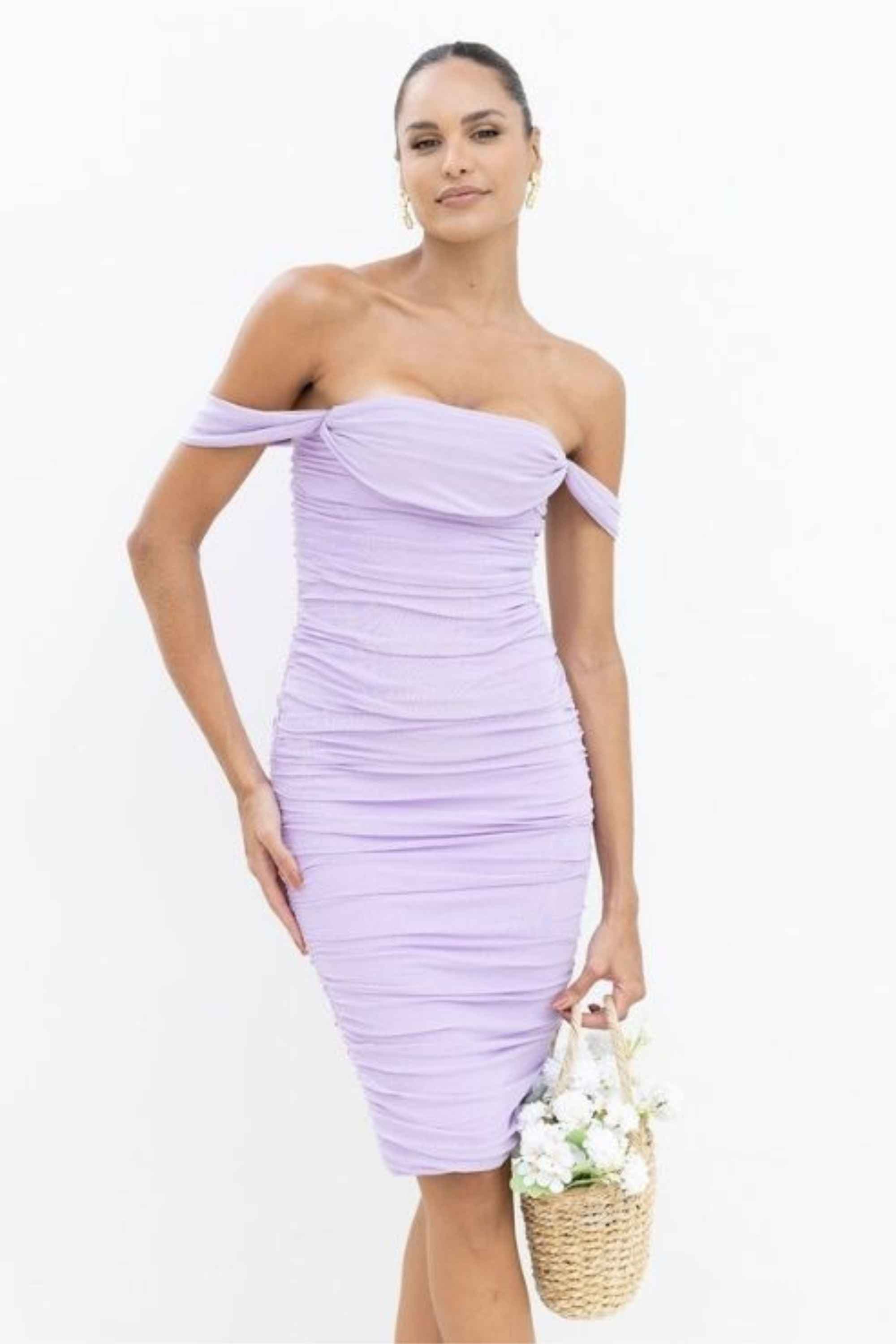 Woman wearing a figure flattering  Zia Bodycon Wrap Dress - White Pearl Bodycon Collection