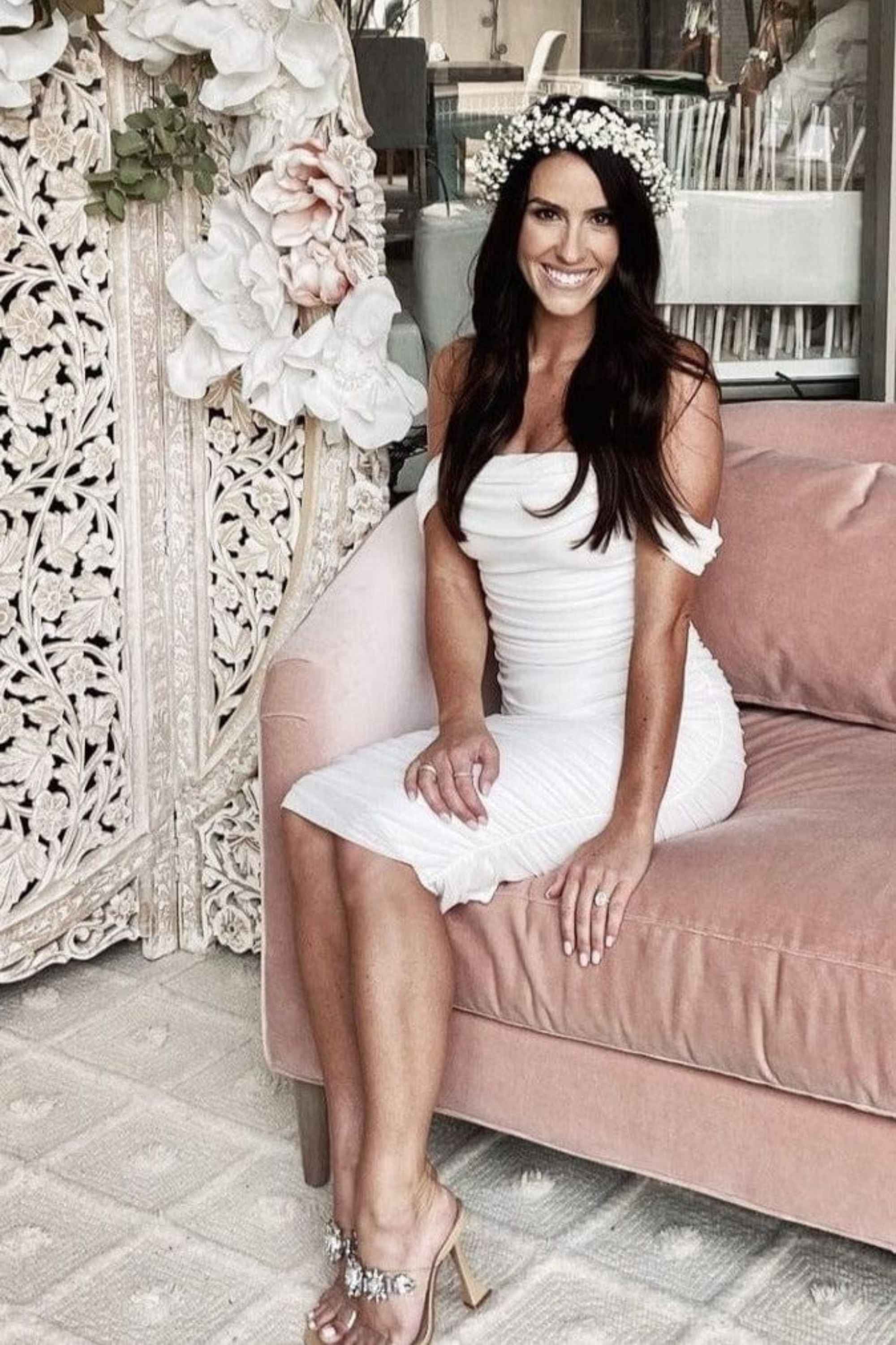 Woman wearing a figure flattering  Zia Bodycon Wrap Midi Dress - Pearl White Bodycon Collection